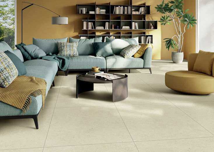 sand colour floor tiles with blue couches